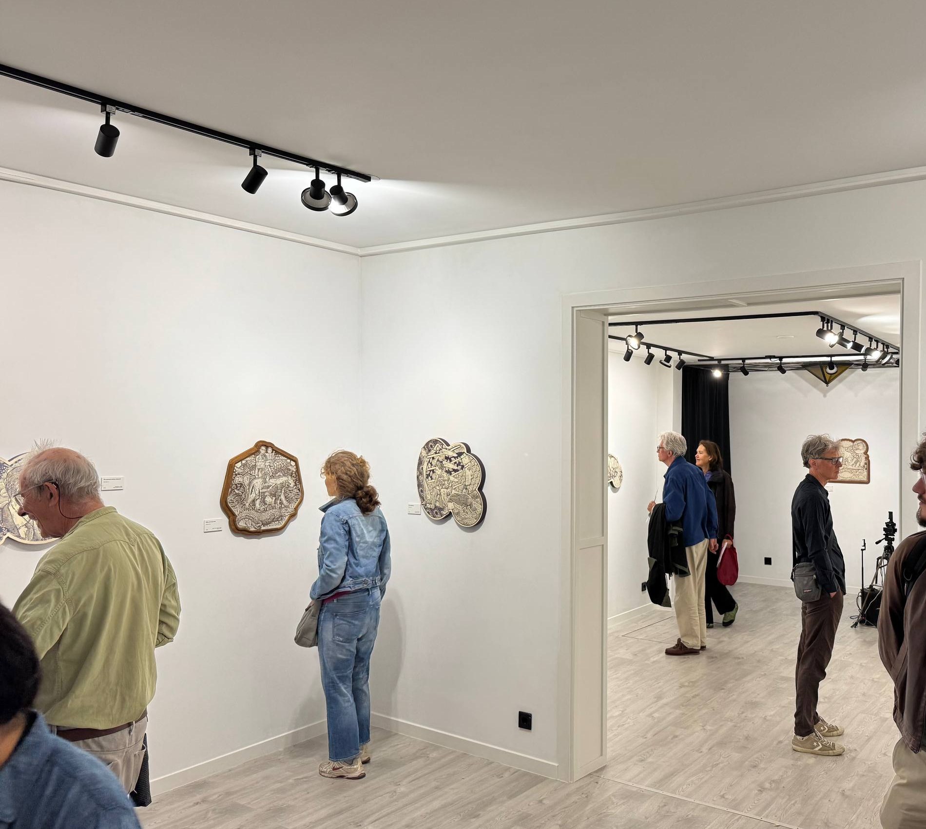 Visitors viewing The Great Filter at NGO DEI, The Hague.